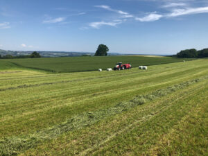 Tractor and bale wrapper