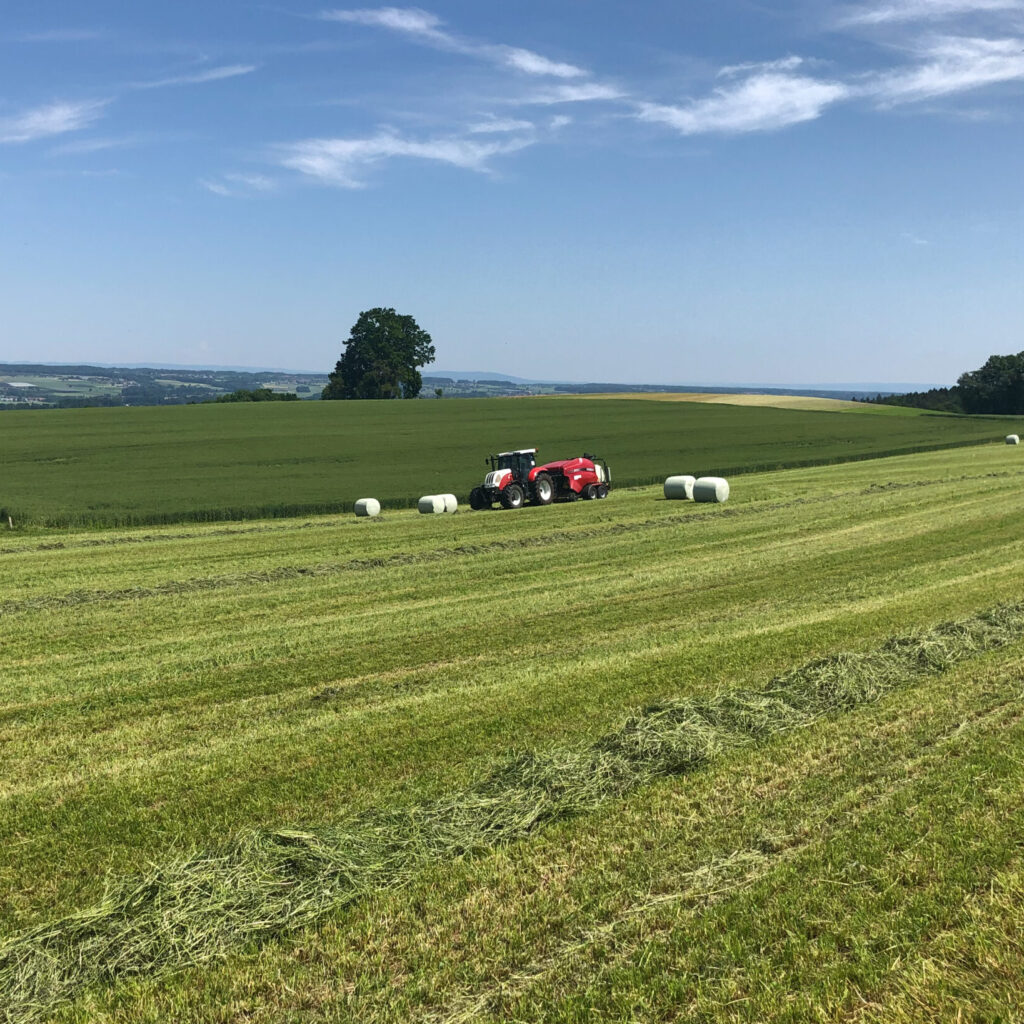 Tractor and bale wrapper