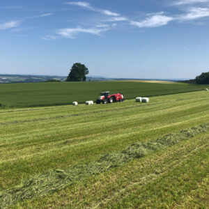 Tractor and bale wrapper